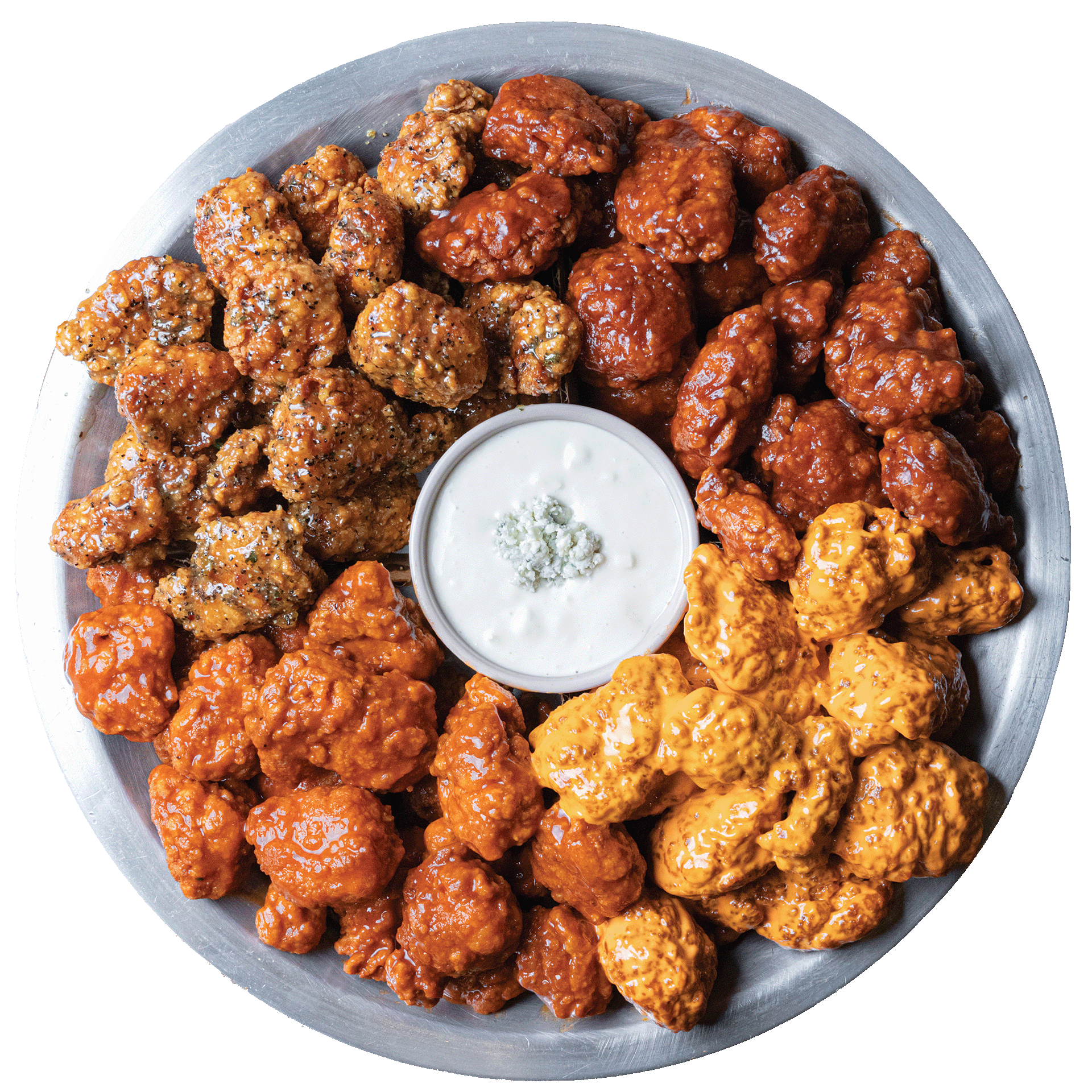 a plate pf boneless multi-flavored chicken wings with a sauce in the middle